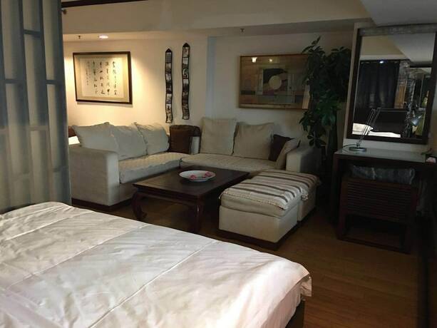 Imagen de la habitación del Hotel Beijing New World CBD Apartment. Foto 32