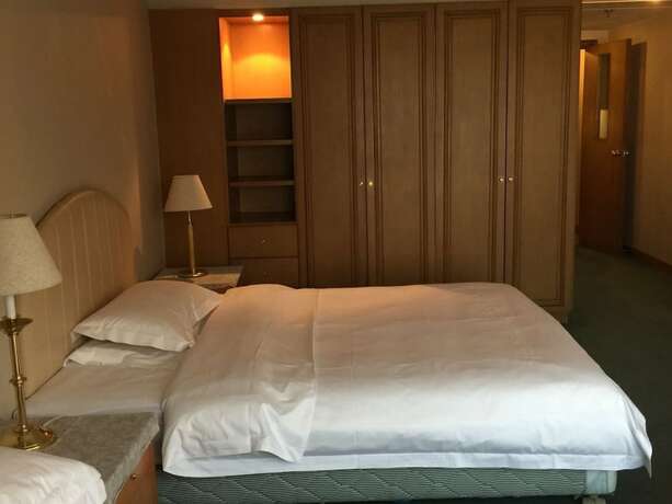 Imagen de la habitación del Hotel Beijing New World CBD Apartment. Foto 37