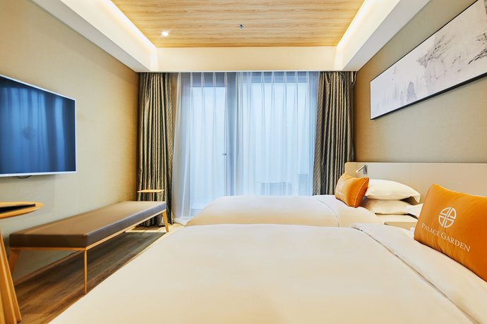 Imagen de la habitación del Hotel Beijing Palace Garden Beiqing. Foto 12