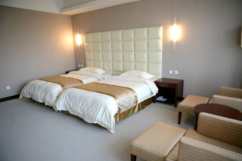 Imagen de la habitación del Hotel Beijing Qiao Bo International Convention Center Ho. Foto 1