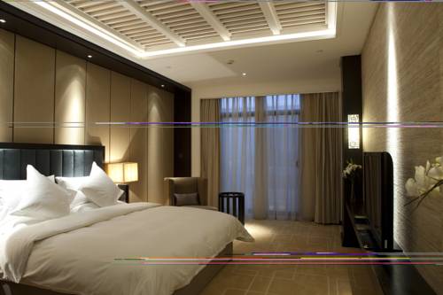 Imagen de la habitación del Hotel Beijing Qushui Lanting Resort. Foto 1