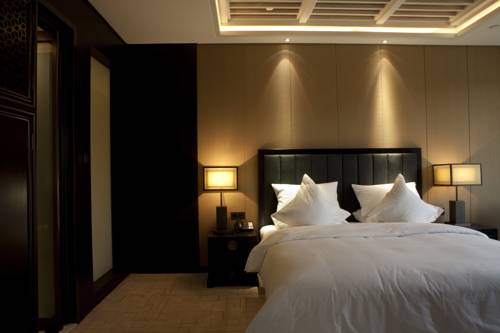 Imagen de la habitación del Hotel Beijing Qushui Lanting Resort. Foto 2