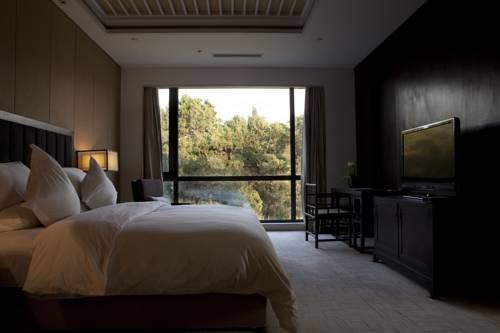 Imagen de la habitación del Hotel Beijing Qushui Lanting Resort. Foto 3