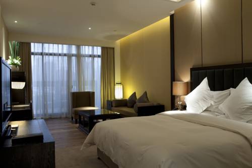 Imagen de la habitación del Hotel Beijing Qushui Lanting Resort. Foto 4