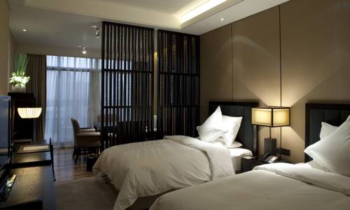 Imagen de la habitación del Hotel Beijing Qushui Lanting Resort. Foto 5