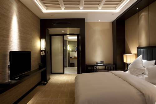 Imagen de la habitación del Hotel Beijing Qushui Lanting Resort. Foto 6