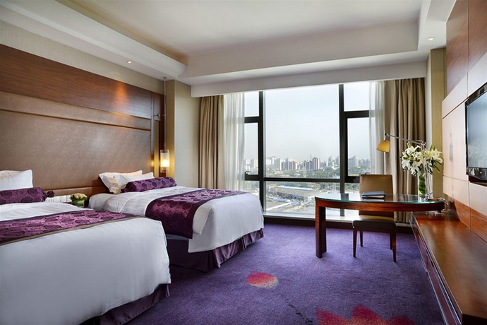 Imagen de la habitación del Hotel Beijing Taishan. Foto 3