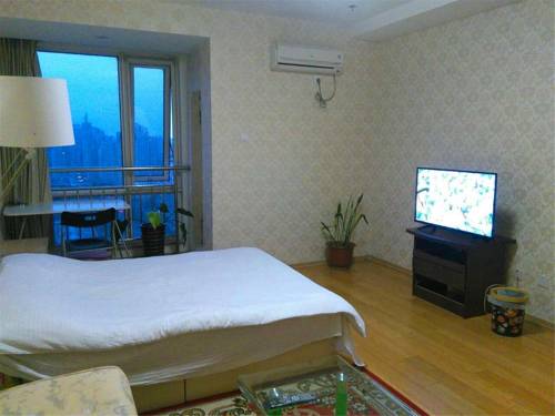 Imagen de la habitación del Hotel Beijing Tiandi Huadian Apartment Youlehui. Foto 4