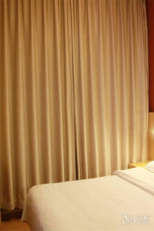 Imagen de la habitación del Hotel Beijing Tiantan Xingcheng. Foto 14