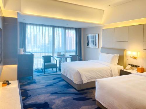 Imagen de la habitación del Hotel Beijing Xiamenair Jianianhua. Foto 5