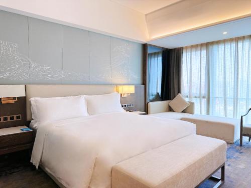Imagen de la habitación del Hotel Beijing Xiamenair Jianianhua. Foto 9
