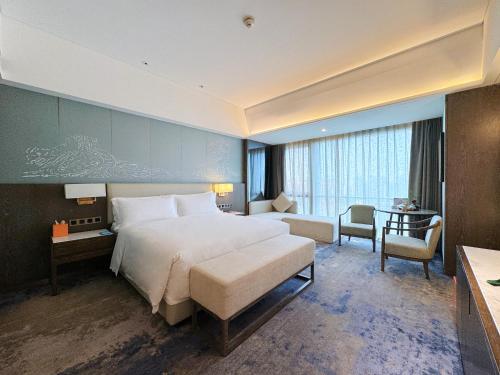 Imagen de la habitación del Hotel Beijing Xiamenair Jianianhua. Foto 10