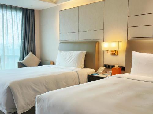 Imagen de la habitación del Hotel Beijing Xiamenair Jianianhua. Foto 14