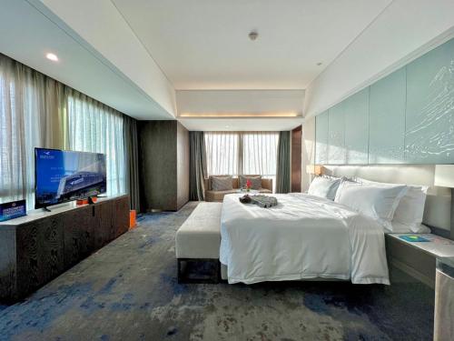 Imagen de la habitación del Hotel Beijing Xiamenair Jianianhua. Foto 15