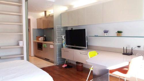 Imagen de la habitación del Hotel Beijing Yasiming Haisheng Service Apartment. Foto 10