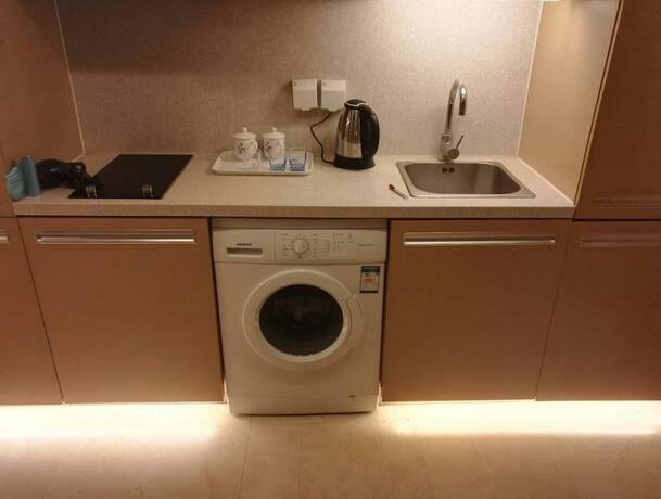 Imagen general del Hotel Beijing Yilejia Apartment. Foto 3