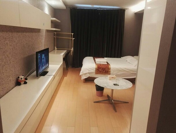 Imagen de la habitación del Hotel Beijing Yilejia Apartment. Foto 11