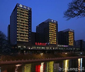 Imagen de los exteriores del Hotel Beijing Yulong International. Foto 12