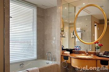 Imagen de la habitación del Hotel Beijing Yulong International. Foto 7