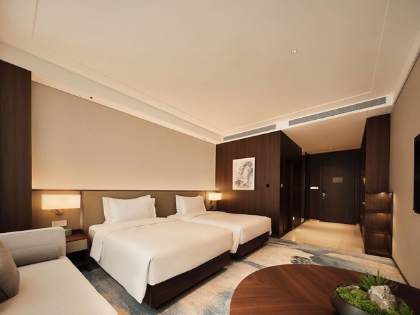 Imagen de la habitación del Hotel Beijing Zhonghe. Foto 2