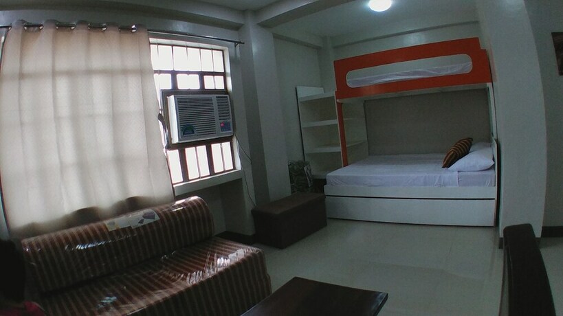 Imagen de la habitación del Hotel Beinte Singko de Marso Apartments. Foto 13