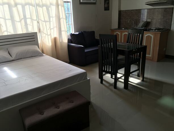 Imagen de la habitación del Hotel Beinte Singko de Marso Apartments. Foto 17