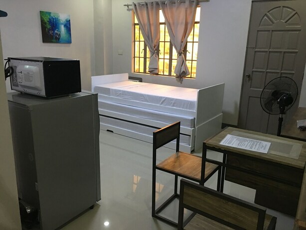 Imagen de la habitación del Hotel Beinte Singko de Marso Apartments. Foto 19