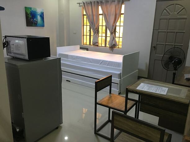 Imagen de la habitación del Hotel Beinte Singko de Marso Apartments. Foto 20