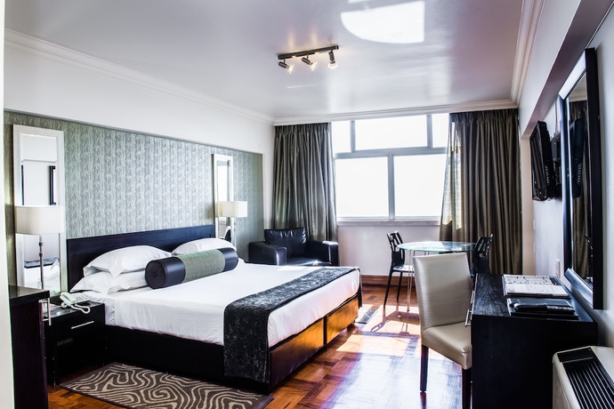 Imagen de la habitación del Hotel Belaire Suites. Foto 10