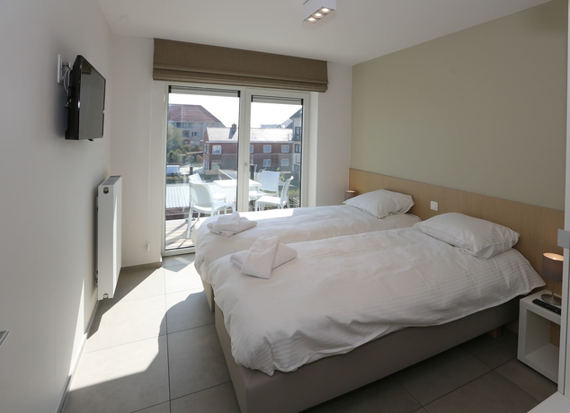 Imagen de la habitación del Hotel Belcasa Family Suites and Lofts. Foto 13