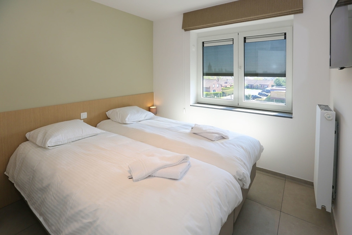 Imagen de la habitación del Hotel Belcasa Family Suites and Lofts. Foto 17
