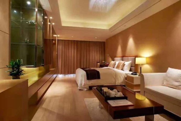 Imagen de la habitación del Hotel Belgravia Suites Wuxi. Foto 2