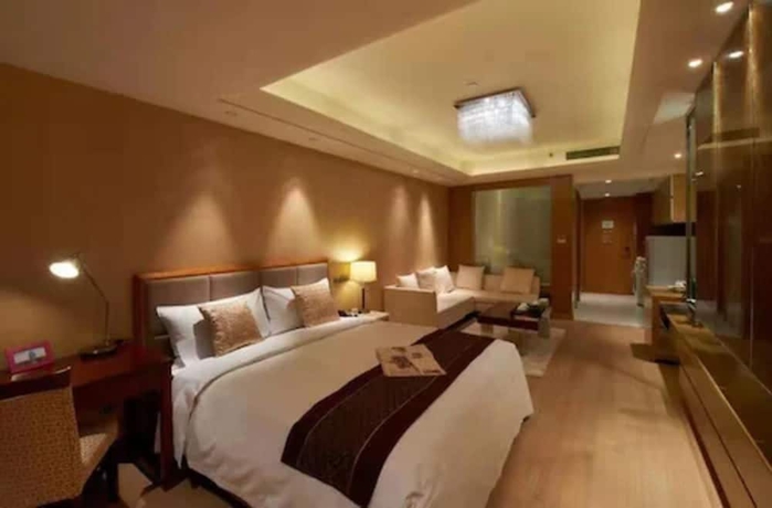 Imagen de la habitación del Hotel Belgravia Suites Wuxi. Foto 3