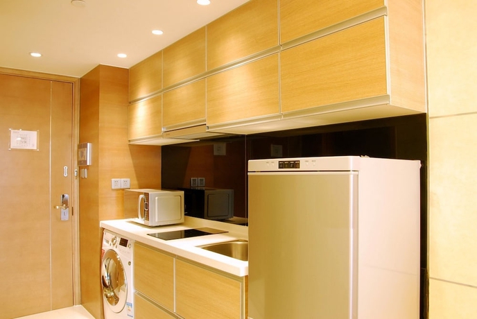 Imagen de la habitación del Hotel Belgravia Suites Wuxi. Foto 5