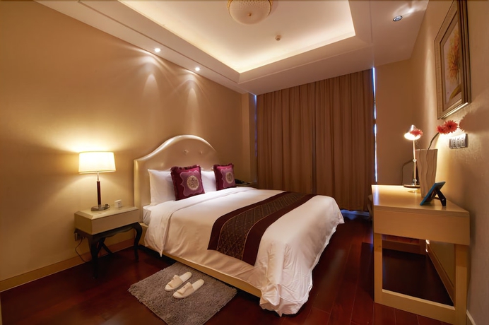 Imagen de la habitación del Hotel Belgravia Suites Wuxi. Foto 6