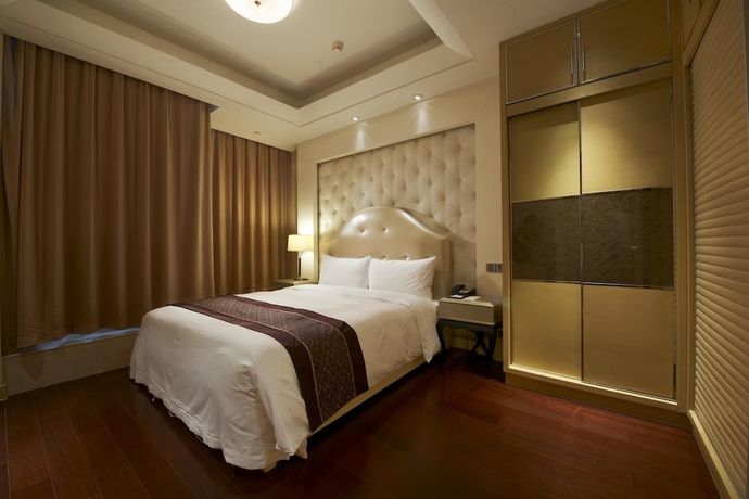 Imagen de la habitación del Hotel Belgravia Suites Wuxi. Foto 8
