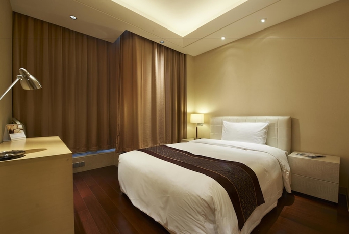 Imagen de la habitación del Hotel Belgravia Suites Wuxi. Foto 9