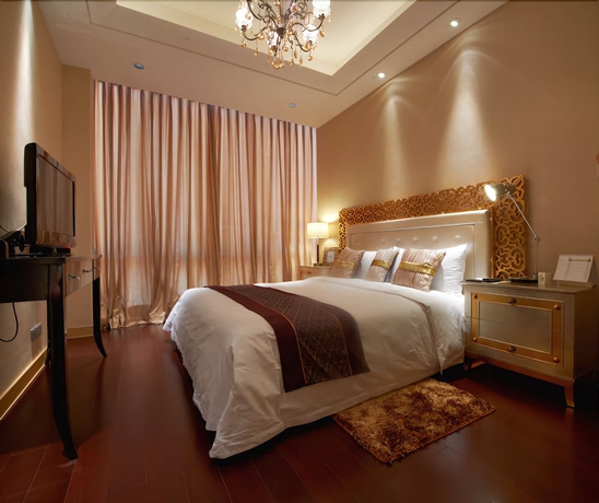 Imagen de la habitación del Hotel Belgravia Suites Wuxi. Foto 10