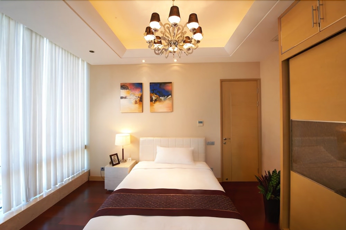 Imagen de la habitación del Hotel Belgravia Suites Wuxi. Foto 11