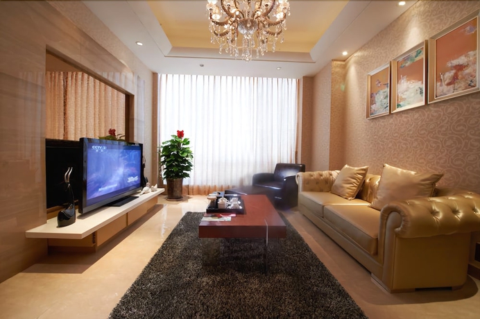 Imagen de la habitación del Hotel Belgravia Suites Wuxi. Foto 15