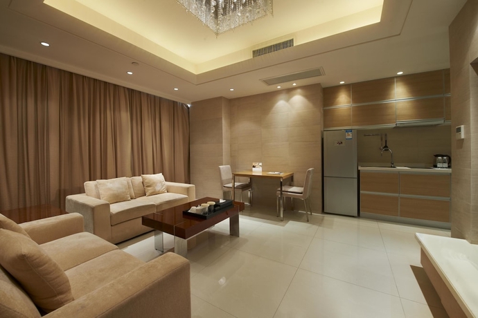 Imagen de la habitación del Hotel Belgravia Suites Wuxi. Foto 16