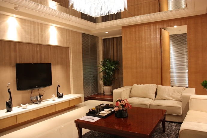 Imagen de la habitación del Hotel Belgravia Suites Wuxi. Foto 17