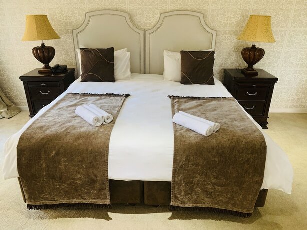 Imagen de la habitación del Hotel Bella Casa Guesthouse. Foto 14