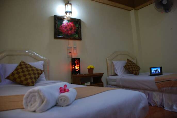 Imagen de la habitación del Hotel Belle Garden. Foto 20