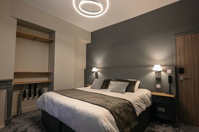 Imagen de la habitación del Hotel Belle Normandy. Foto 15