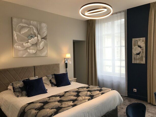 Imagen de la habitación del Hotel Belle Normandy. Foto 18