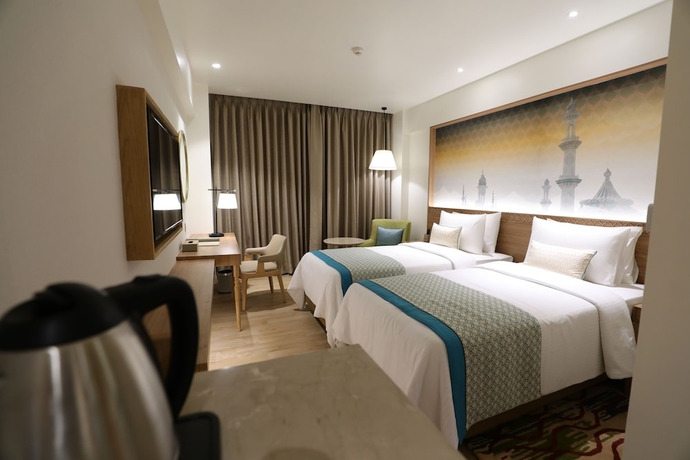 Imagen de la habitación del Hotel Bellevue Sarovar Premiere Junagadh. Foto 8