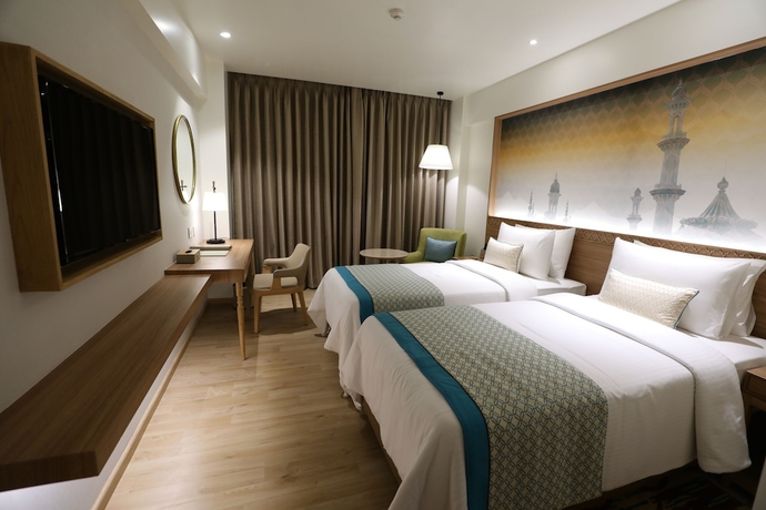 Imagen de la habitación del Hotel Bellevue Sarovar Premiere Junagadh. Foto 9