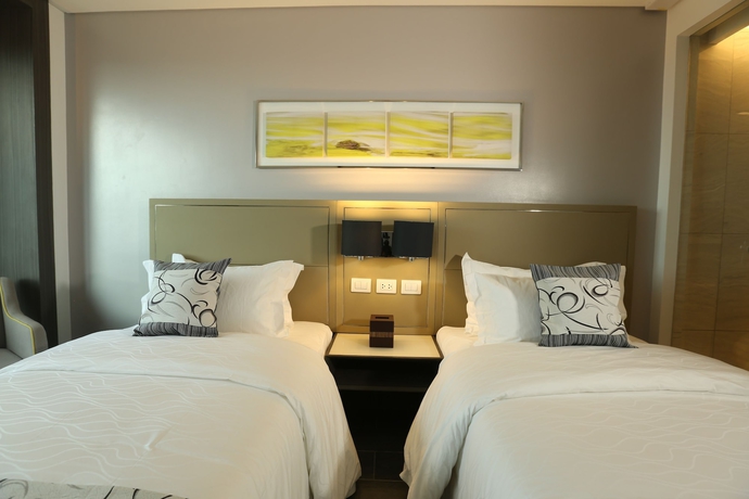 Imagen de la habitación del Hotel Belmont Manila. Foto 7