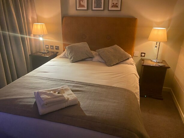 Imagen de la habitación del Hotel Belmore. Foto 18